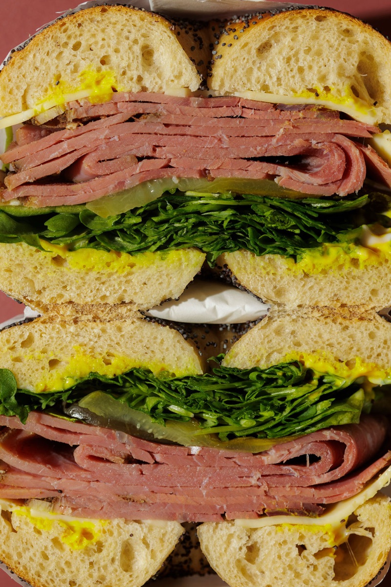 Deli Stack — pastrami, rocket, mustard mayo, emmental and gherkins, cross-section.