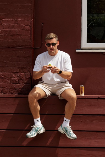 A customer eating outside the Junto cafe — photo 233