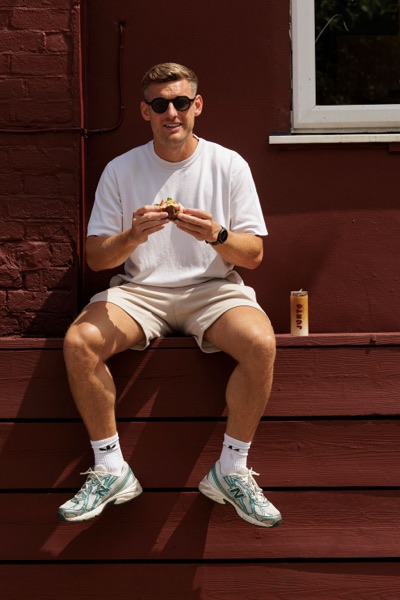A customer eating outside the Junto cafe — photo 239