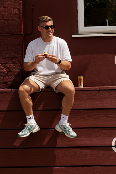 A customer eating outside the Junto cafe — photo 240