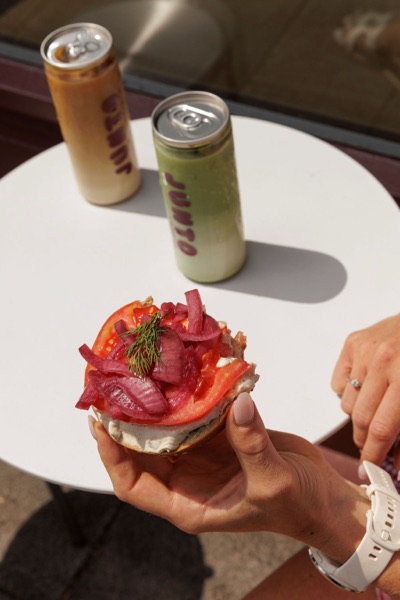 A customer eating outside the Junto cafe — photo 257